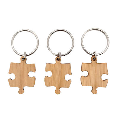 Hölzerne zusammenpassende Puzzlespielschlüsselbambuskette, die UVdrucken graviert
